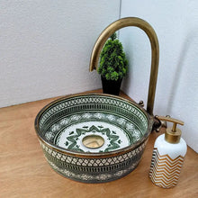 Load image into Gallery viewer, Ceramic sink with decorative patterns, gold faucet, and soap dispenser on a wooden surface.