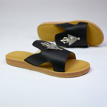 Load image into Gallery viewer, Side view of handmade black leather slide sandals with Berber silver adornments