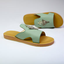 Load image into Gallery viewer, Pair angle of handmade mint green leather slide sandals with Berber silver adornments