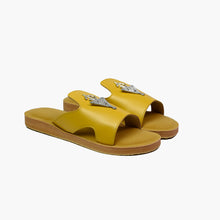 Load image into Gallery viewer, Main angle view of handmade mustard yellow leather slide sandals with Berber silver adornments
