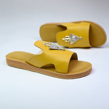 Load image into Gallery viewer, Pair angle of handmade mustard yellow leather slide sandals with Berber silver adornments