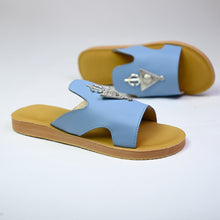 Load image into Gallery viewer, Pair angle of handmade sky blue leather slide sandals with Berber silver adornments